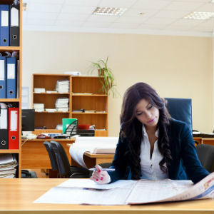 Woman working in an office overtime
