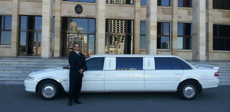 Chauffeur Standing By Limo