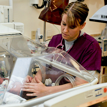 Nurse Caring For Infant