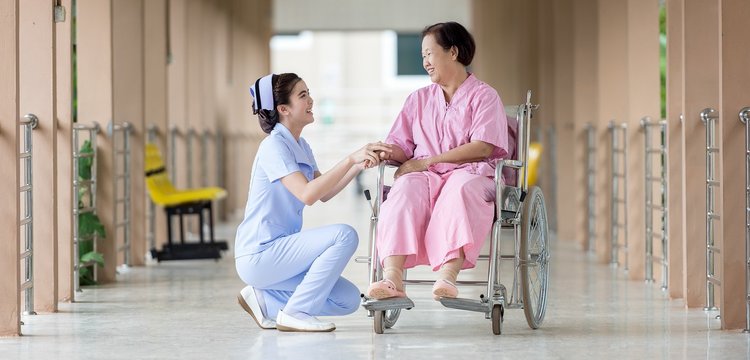 Nurse With Elderly Patient