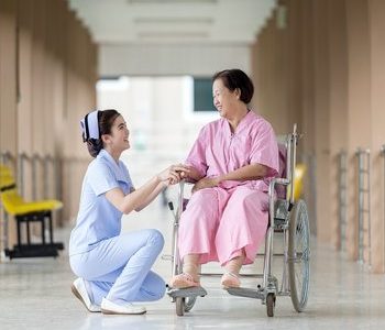 Patient In Wheelchair with Nurse